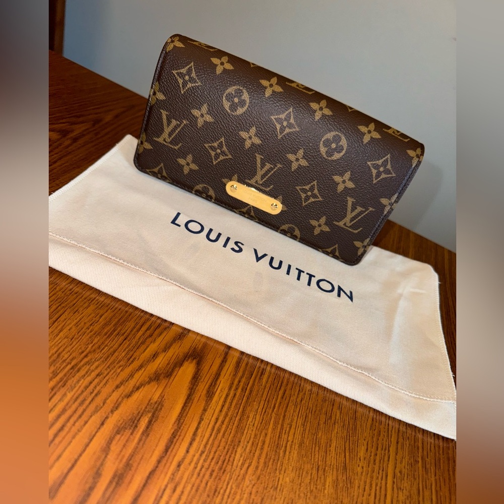Louis Vuitton Lily wallet on a chain.